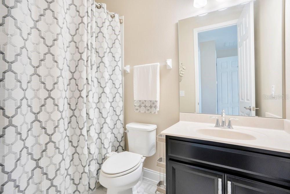 805 Riviera Bella Drive DeBary, FL 32713 - Photo 43 of 86 a bathroom with a sink and a toilet