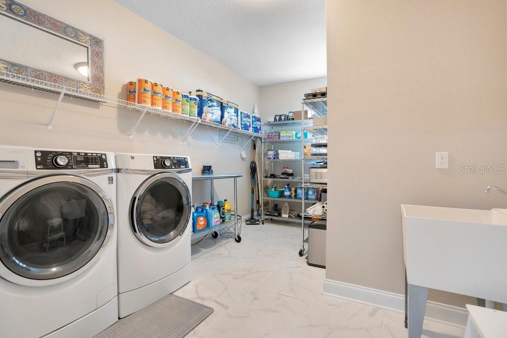 805 Riviera Bella Drive DeBary, FL 32713 - Photo 50 of 86 a utility room with dryer and washer