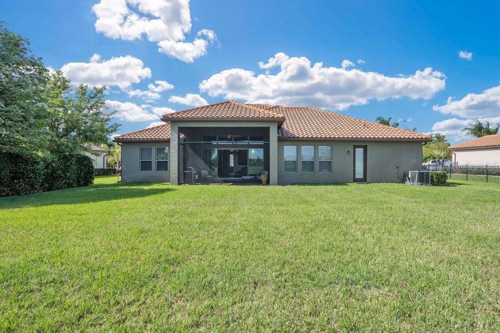 805 Riviera Bella Drive DeBary, FL 32713 - Photo 56 of 86 a view of a house with a backyard