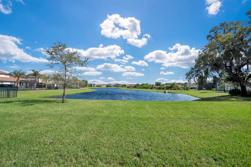 805 Riviera Bella Drive DeBary, FL 32713 - Photo 59 of 86 a view of a golf course with a lake