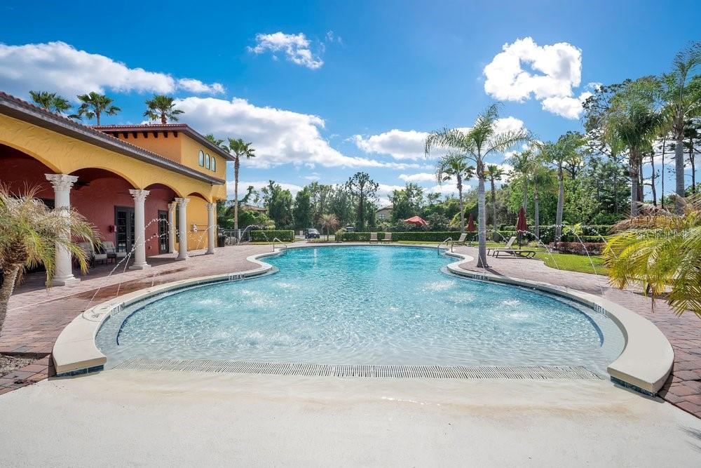 805 Riviera Bella Drive DeBary, FL 32713 - Photo 74 of 86 a view of a house with a yard and a chandelier