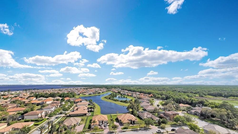 805 Riviera Bella Drive DeBary, FL 32713 - Photo 78 of 86 an aerial view of a house with lots of residential buildings ocean and mountain view in back