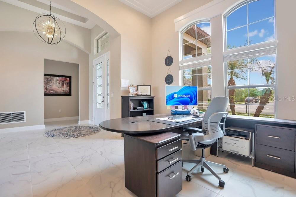 805 Riviera Bella Drive DeBary, FL 32713 - Photo 8 of 86 a view of a workspace with furniture and a window