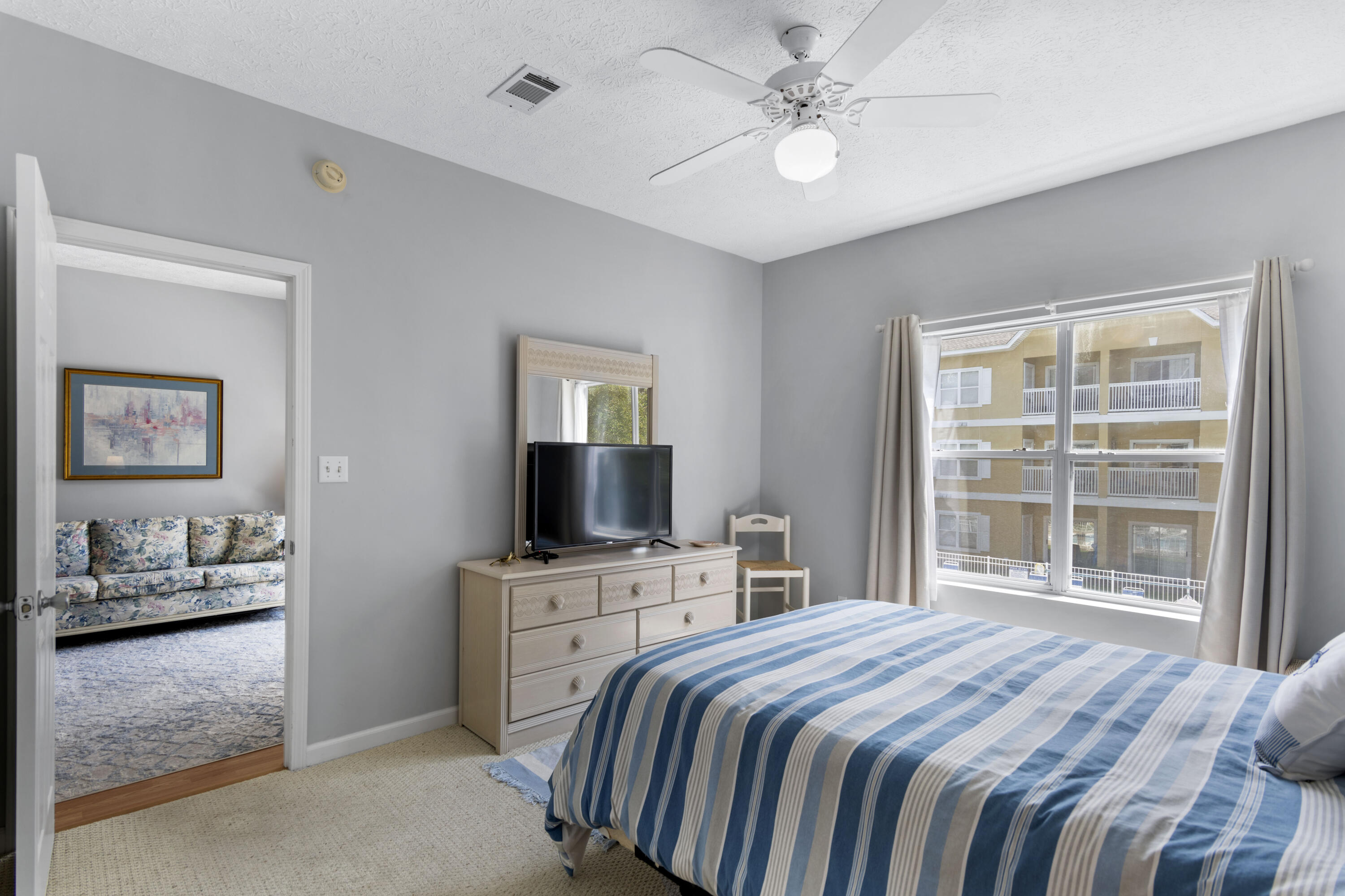 34 Heron's Watch Way, Unit 2202 Santa Rosa Beach, FL 32459 - Photo 17 of 29 a bedroom with a bed and a flat screen tv