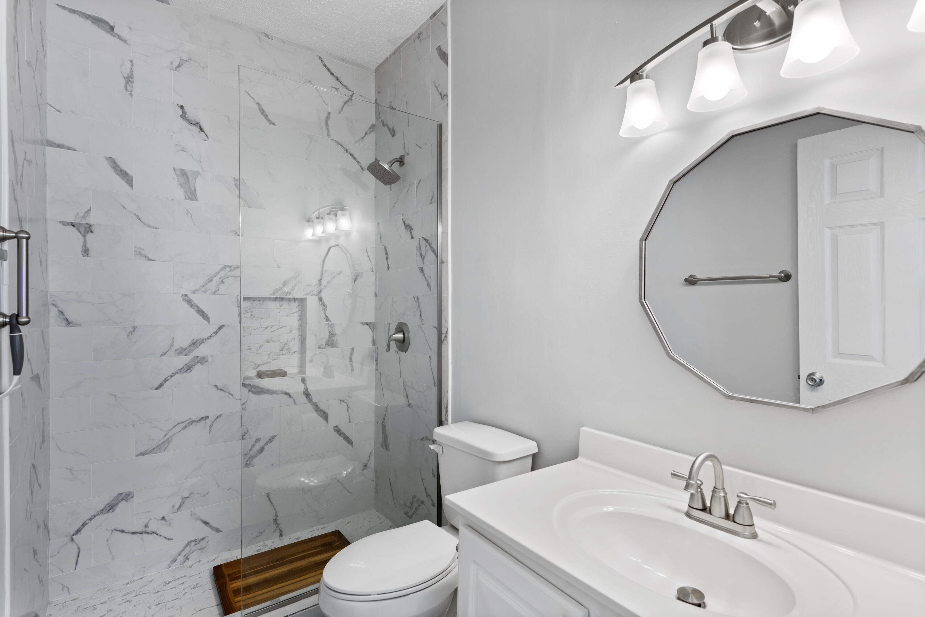 34 Heron's Watch Way, Unit 2202 Santa Rosa Beach, FL 32459 - Photo 19 of 29 a bathroom with a sink toilet and shower