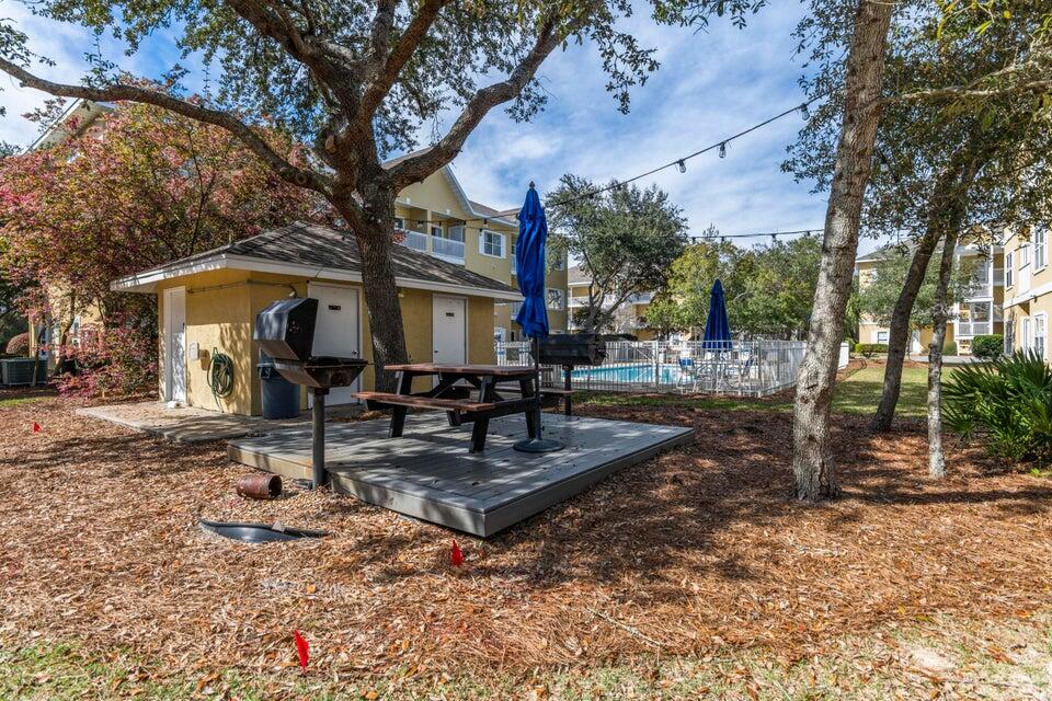 34 Heron's Watch Way, Unit 2202 Santa Rosa Beach, FL 32459 - Photo 25 of 29 a view of a house with backyard porch and sitting area