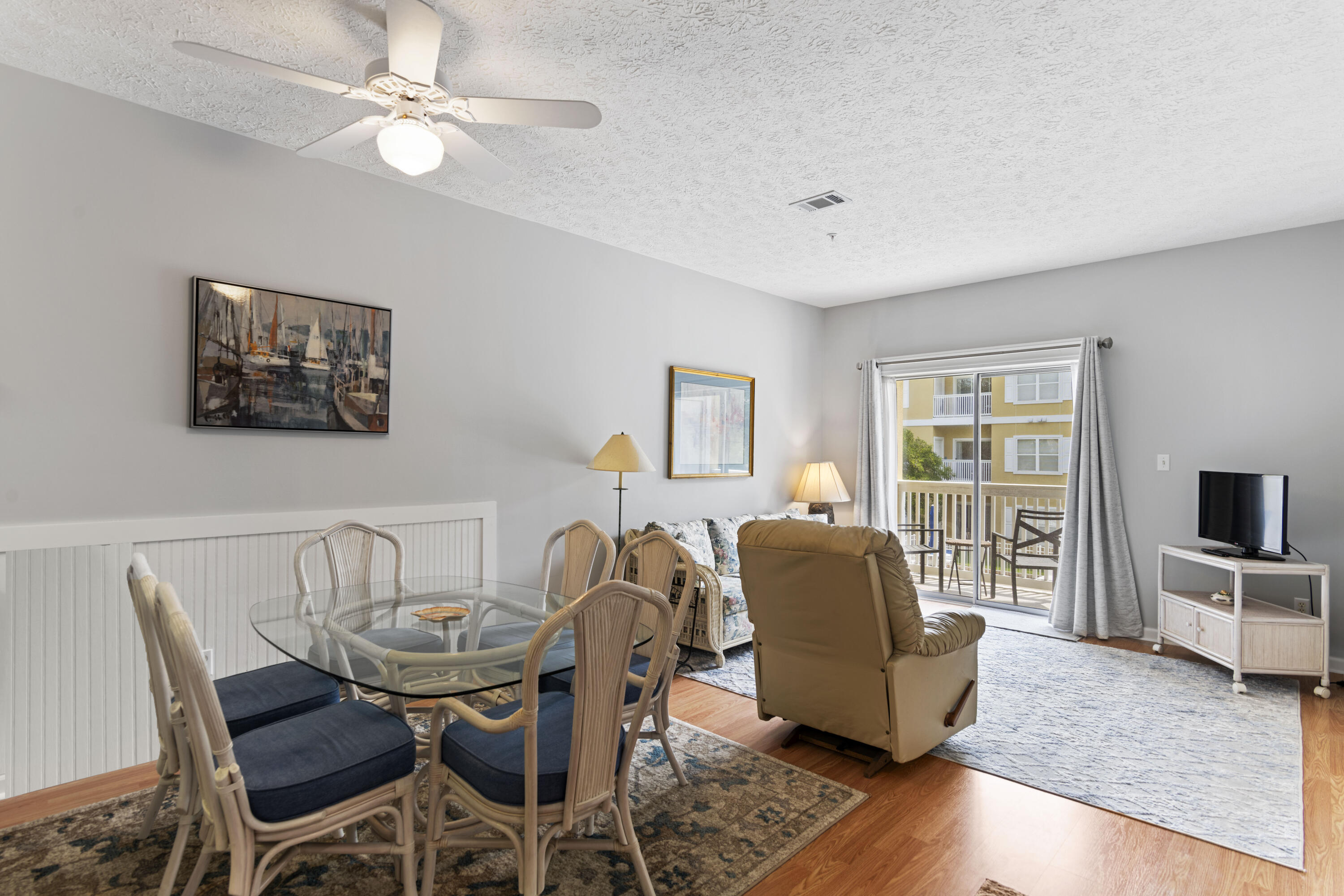 34 Heron's Watch Way, Unit 2202 Santa Rosa Beach, FL 32459 - Photo 5 of 29 a living room with furniture and a flat screen tv
