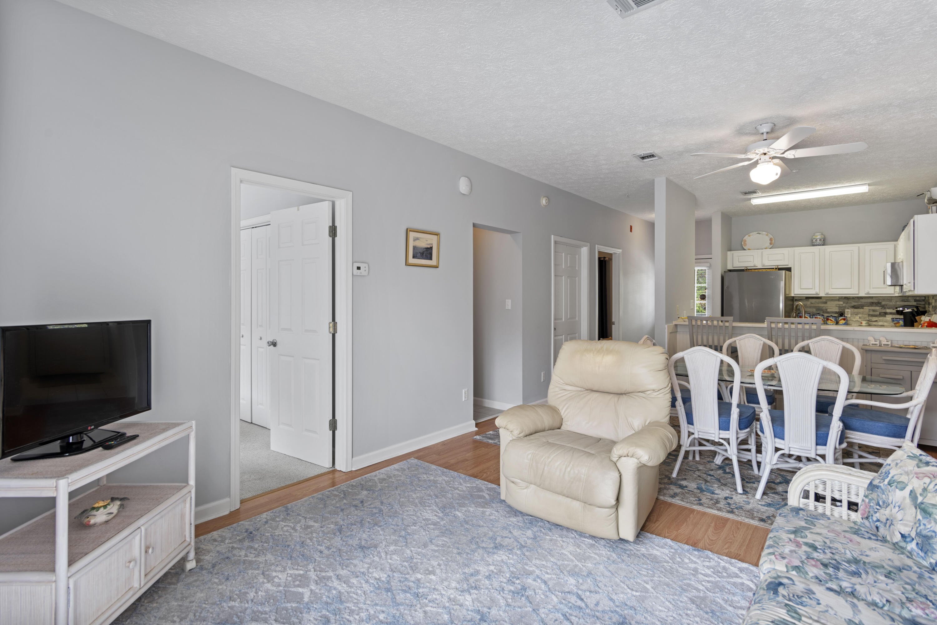 34 Heron's Watch Way, Unit 2202 Santa Rosa Beach, FL 32459 - Photo 8 of 29 a living room with furniture and a flat screen tv