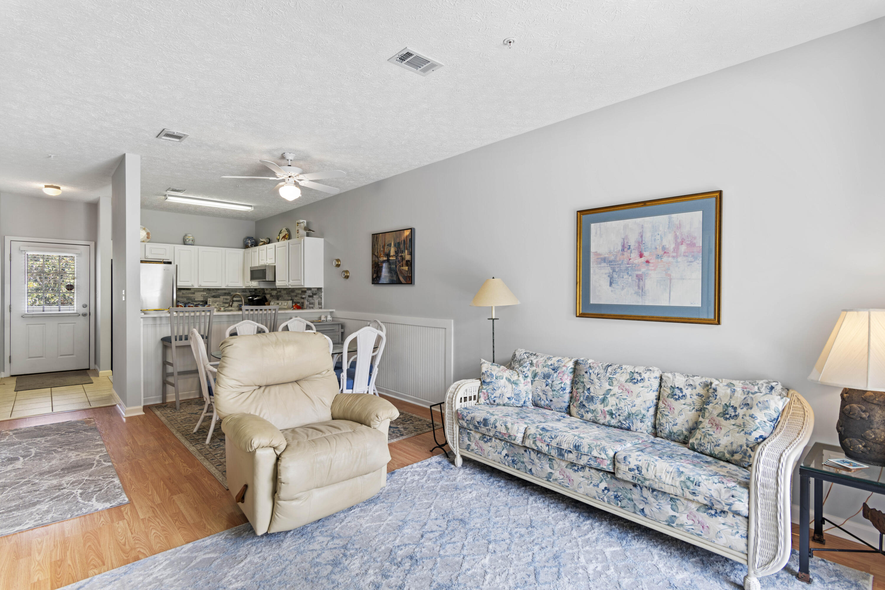34 Heron's Watch Way, Unit 2202 Santa Rosa Beach, FL 32459 - Photo 9 of 29 a living room with furniture and a view of kitchen