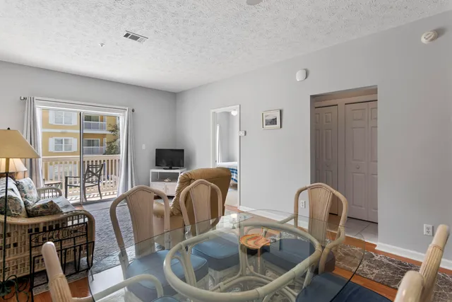 a living room with furniture a window and a table