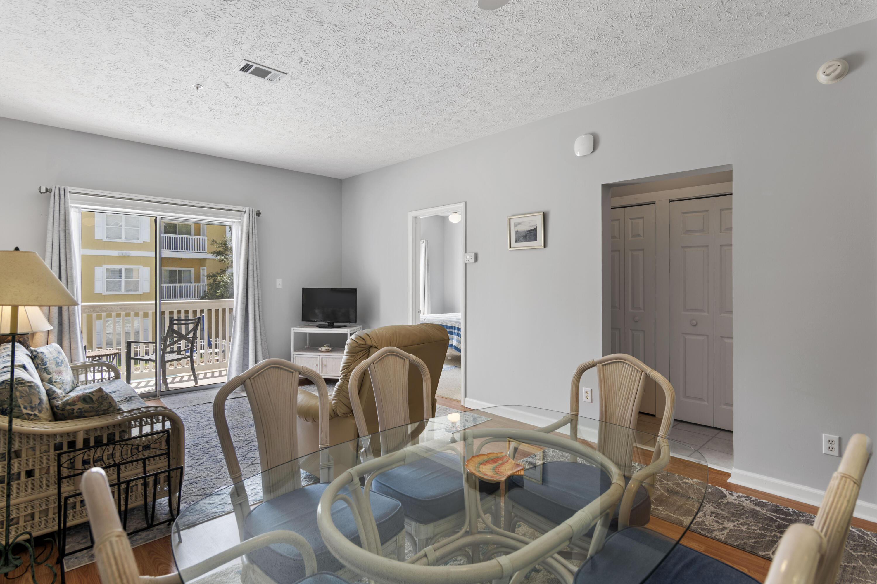 34 Heron's Watch Way, Unit 2202 Santa Rosa Beach, FL 32459 - Photo 10 of 29 a living room with furniture a window and a table