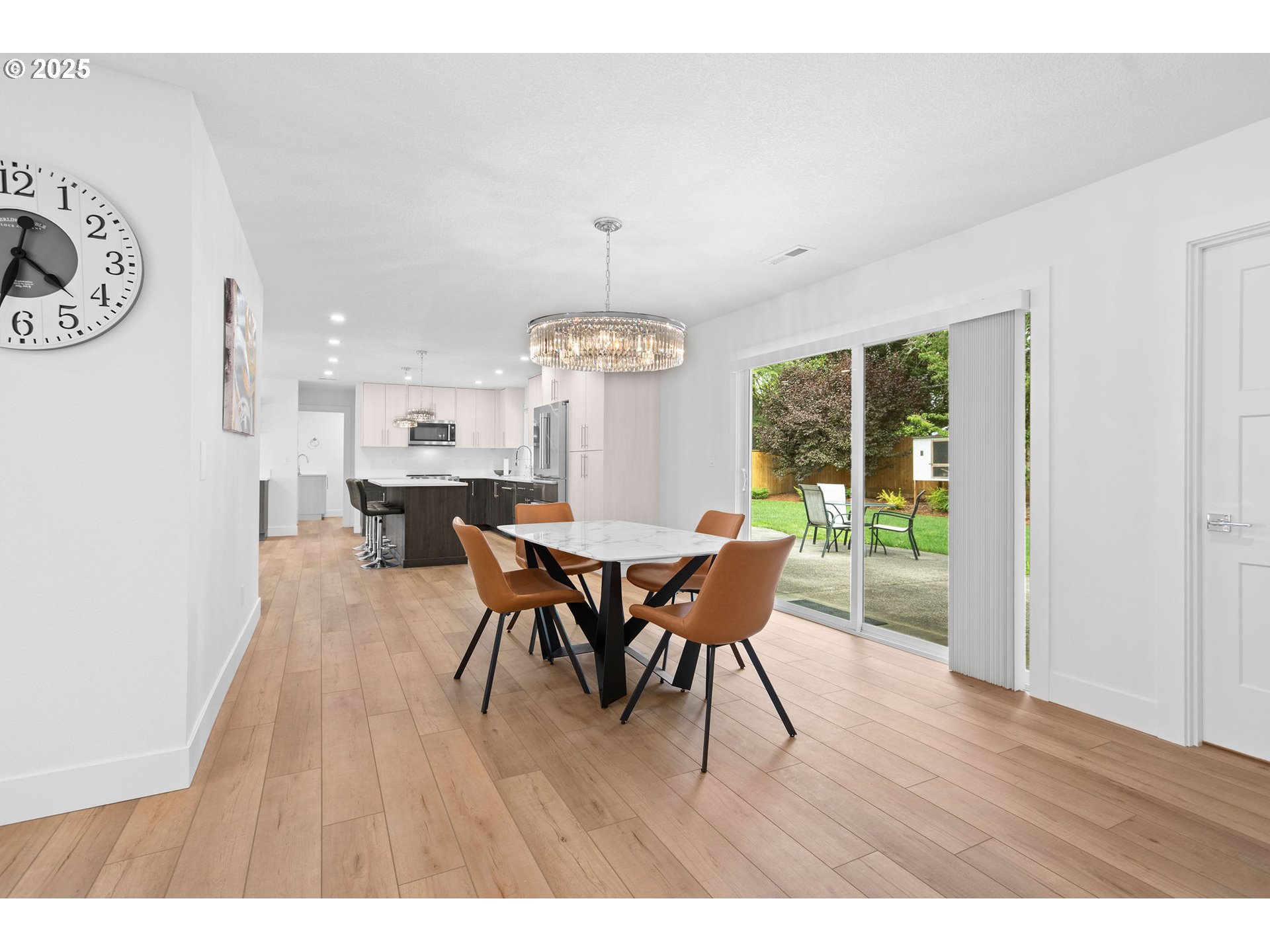 207 Phoenix Way Vancouver, WA 98661 - Photo 13 of 48 a view of a dining room with furniture and wooden floor