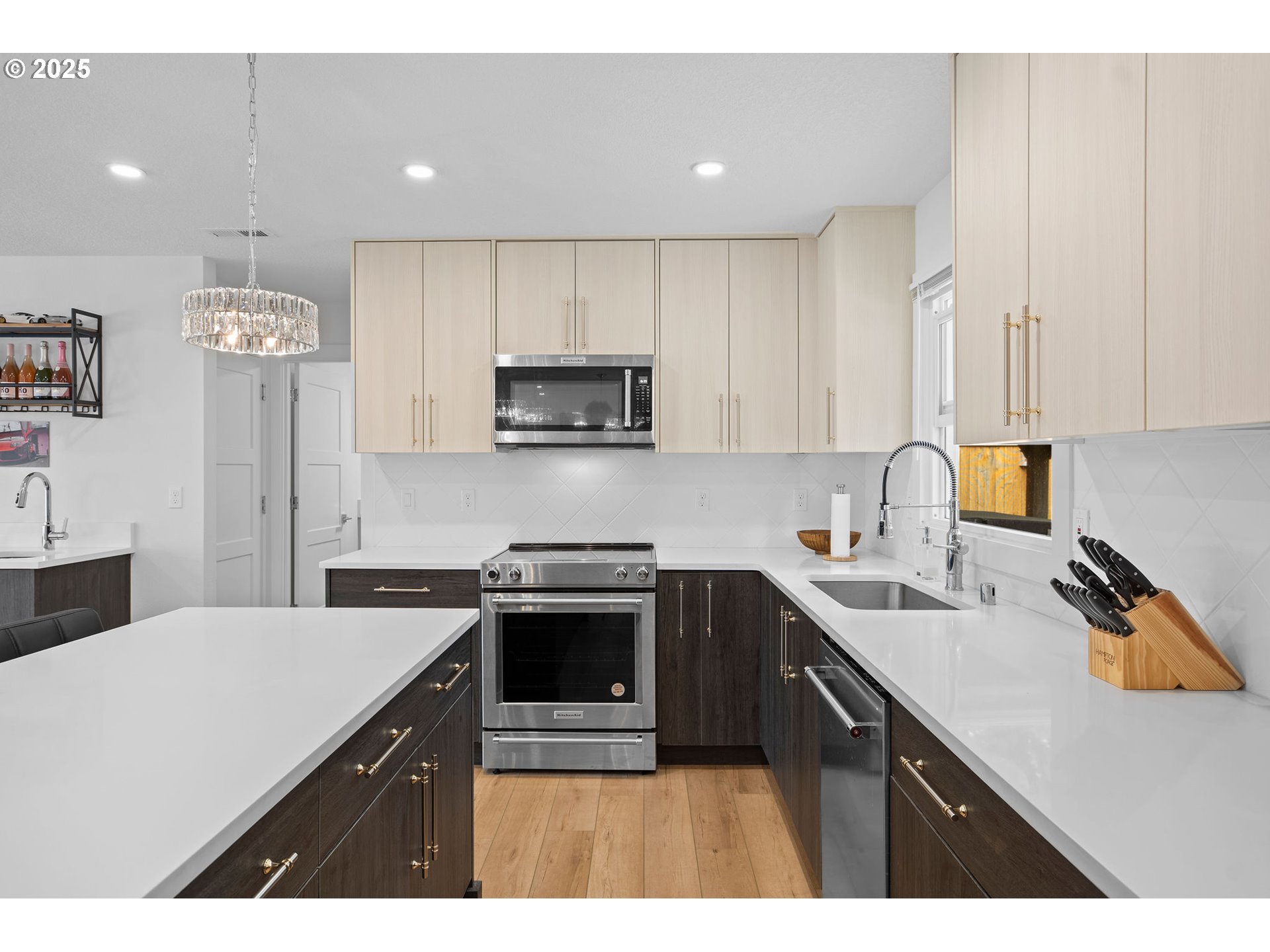 207 Phoenix Way Vancouver, WA 98661 - Photo 16 of 48 a kitchen with stainless steel appliances a sink a stove a refrigerator a center island and cabinets