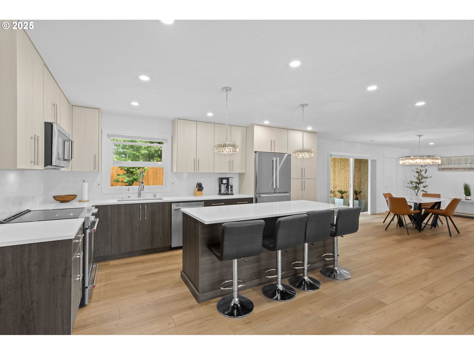 207 Phoenix Way Vancouver, WA 98661 - Photo 18 of 48 a kitchen with a dining table chairs and large window