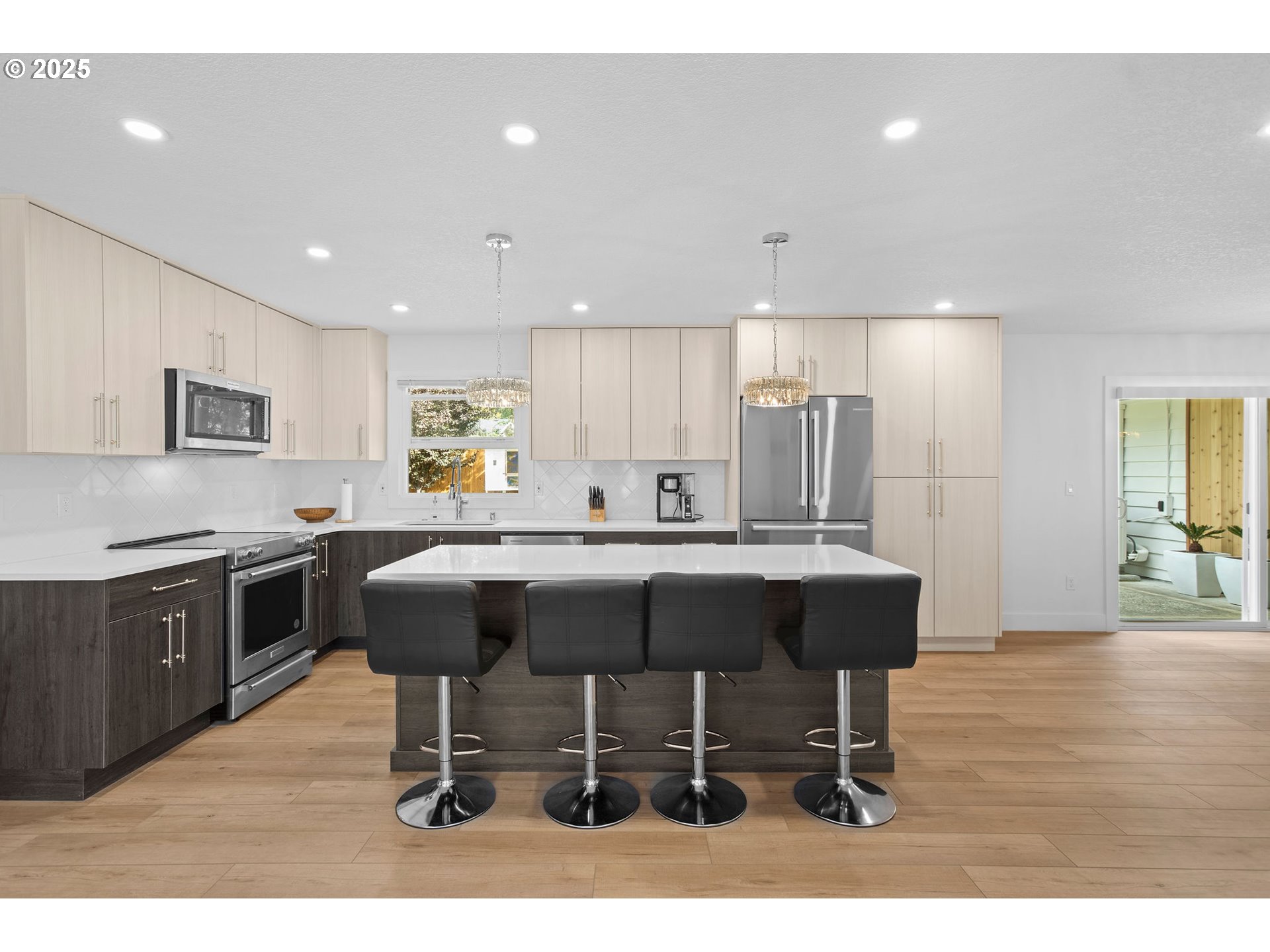 207 Phoenix Way Vancouver, WA 98661 - Photo 19 of 48 a kitchen with a sink cabinets and wooden floor