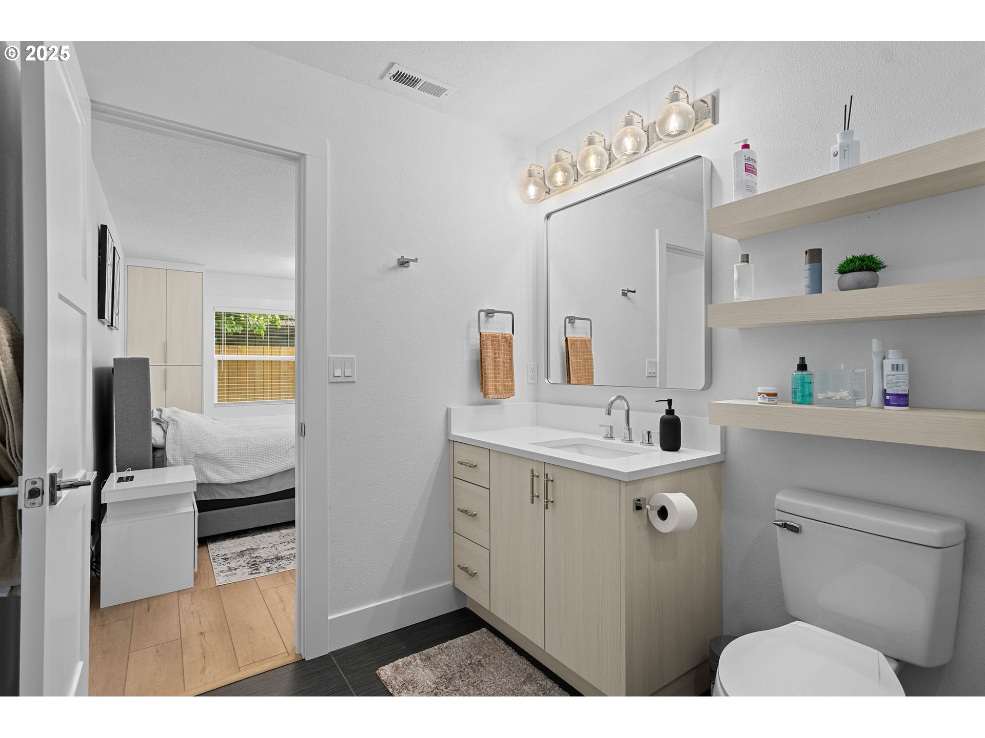 207 Phoenix Way Vancouver, WA 98661 - Photo 30 of 48 a bathroom with a sink a toilet and a mirror