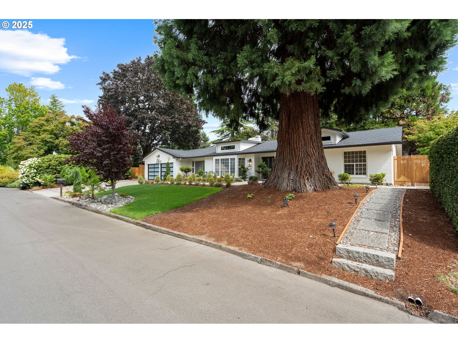 207 Phoenix Way Vancouver, WA 98661 - Photo 3 of 48 a front view of a house with a yard and a garage