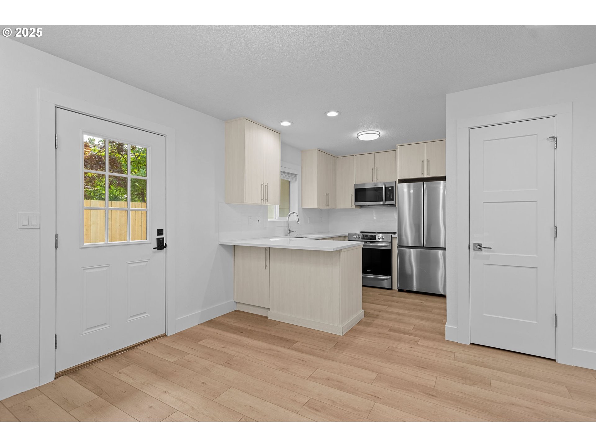 207 Phoenix Way Vancouver, WA 98661 - Photo 33 of 48 a kitchen with a refrigerator and white cabinets