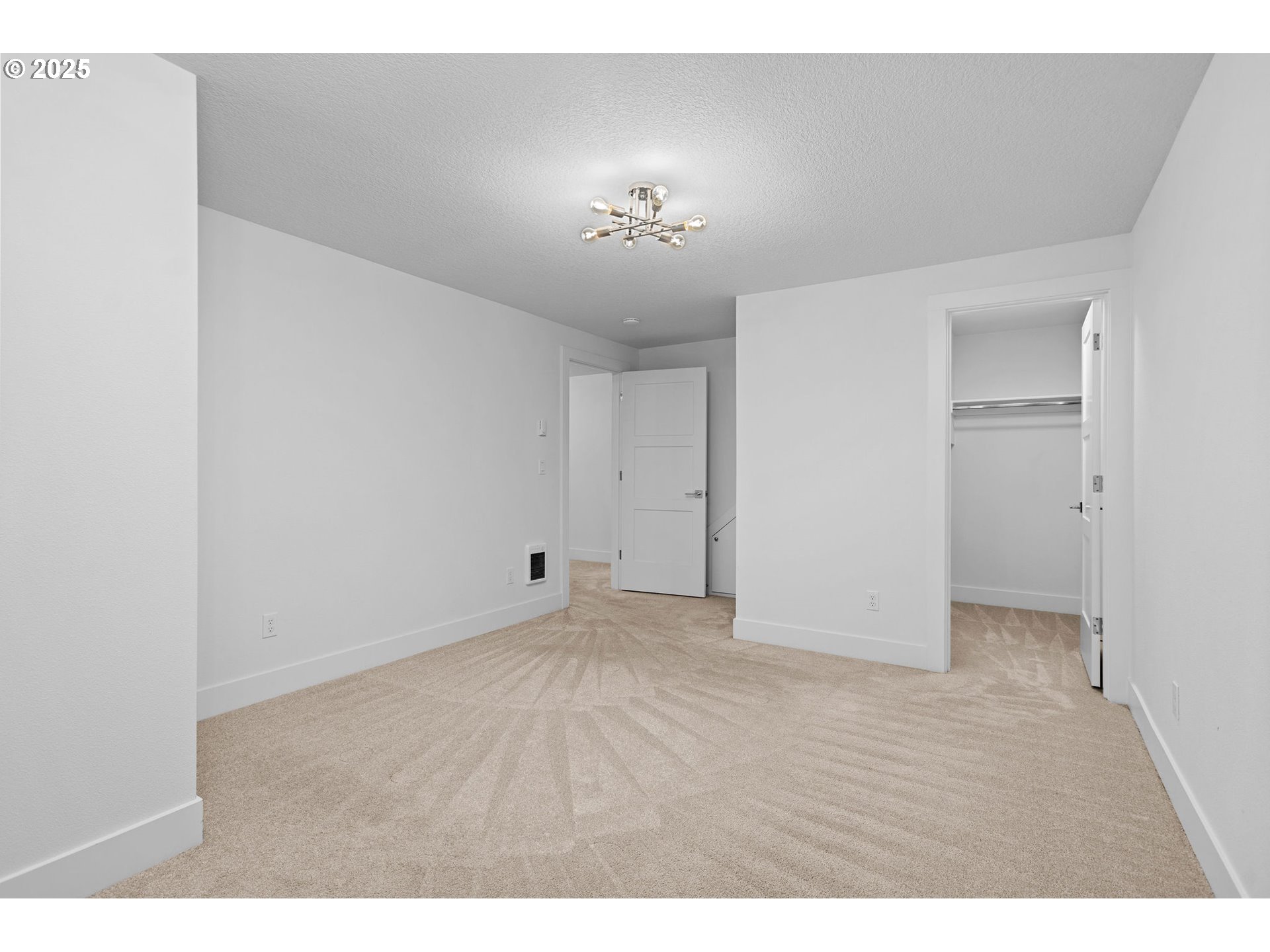 207 Phoenix Way Vancouver, WA 98661 - Photo 43 of 48 a view of an empty room with a chandelier fan