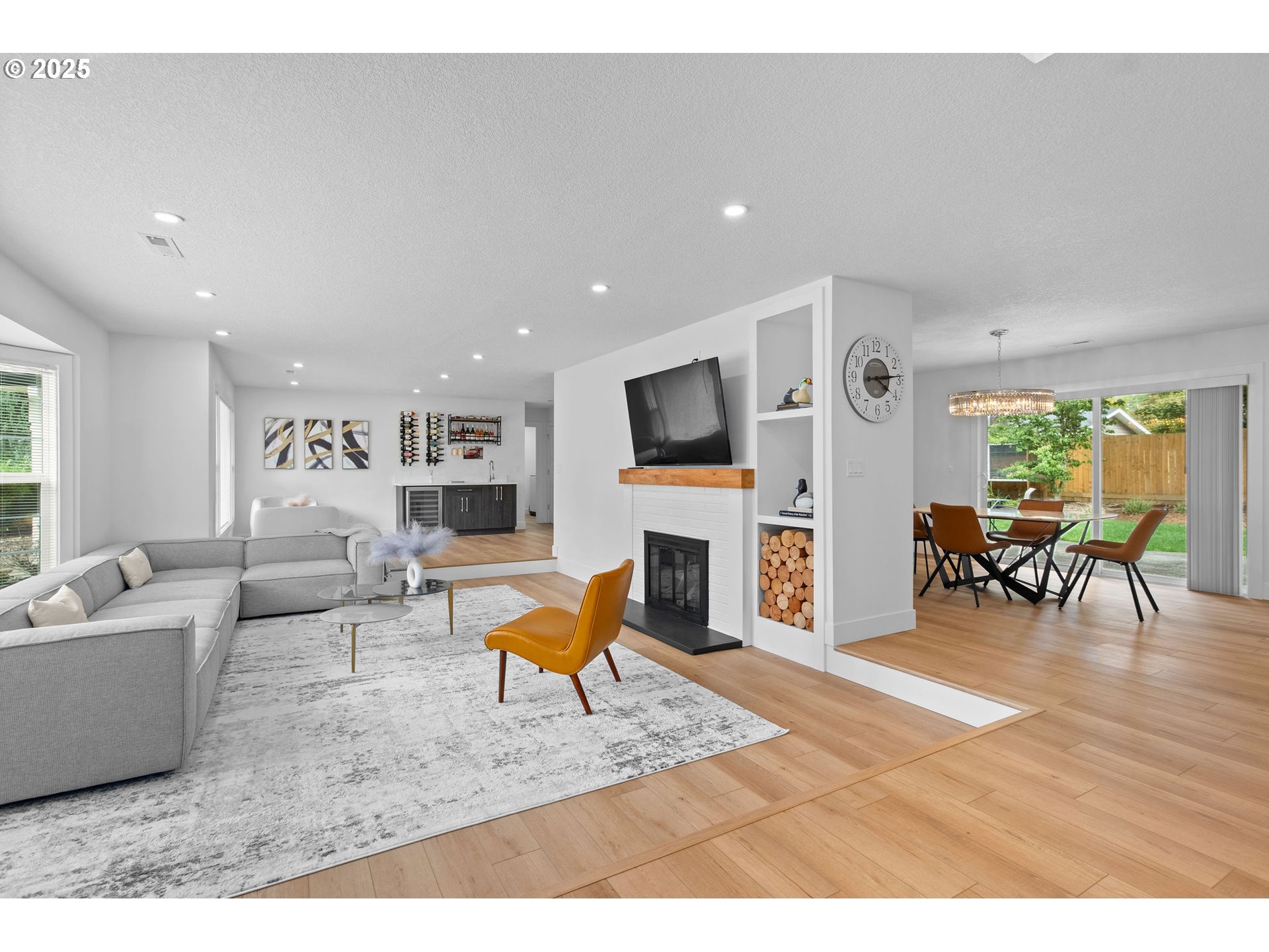 207 Phoenix Way Vancouver, WA 98661 - Photo 7 of 48 a living room with furniture a flat screen tv and a fireplace