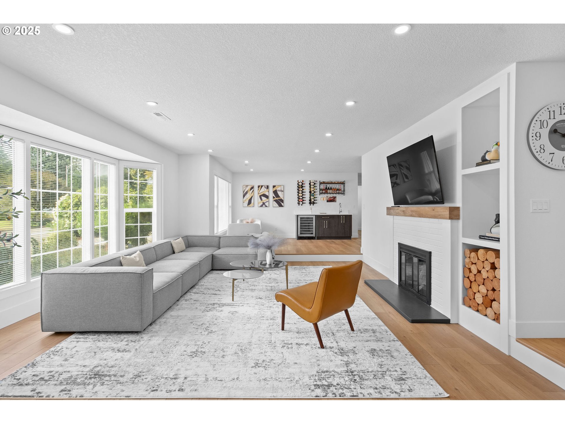 207 Phoenix Way Vancouver, WA 98661 - Photo 9 of 48 a living room with furniture a flat screen tv and a fireplace