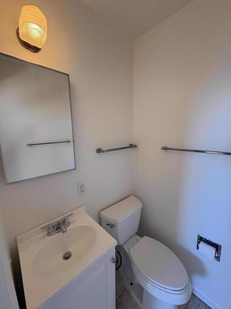 1675 Luxton Street Seaside, CA 93955 - Photo 23 of 33 a white toilet sitting next to a bathroom sink