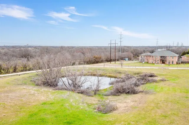 a view of a yard with swimming pool