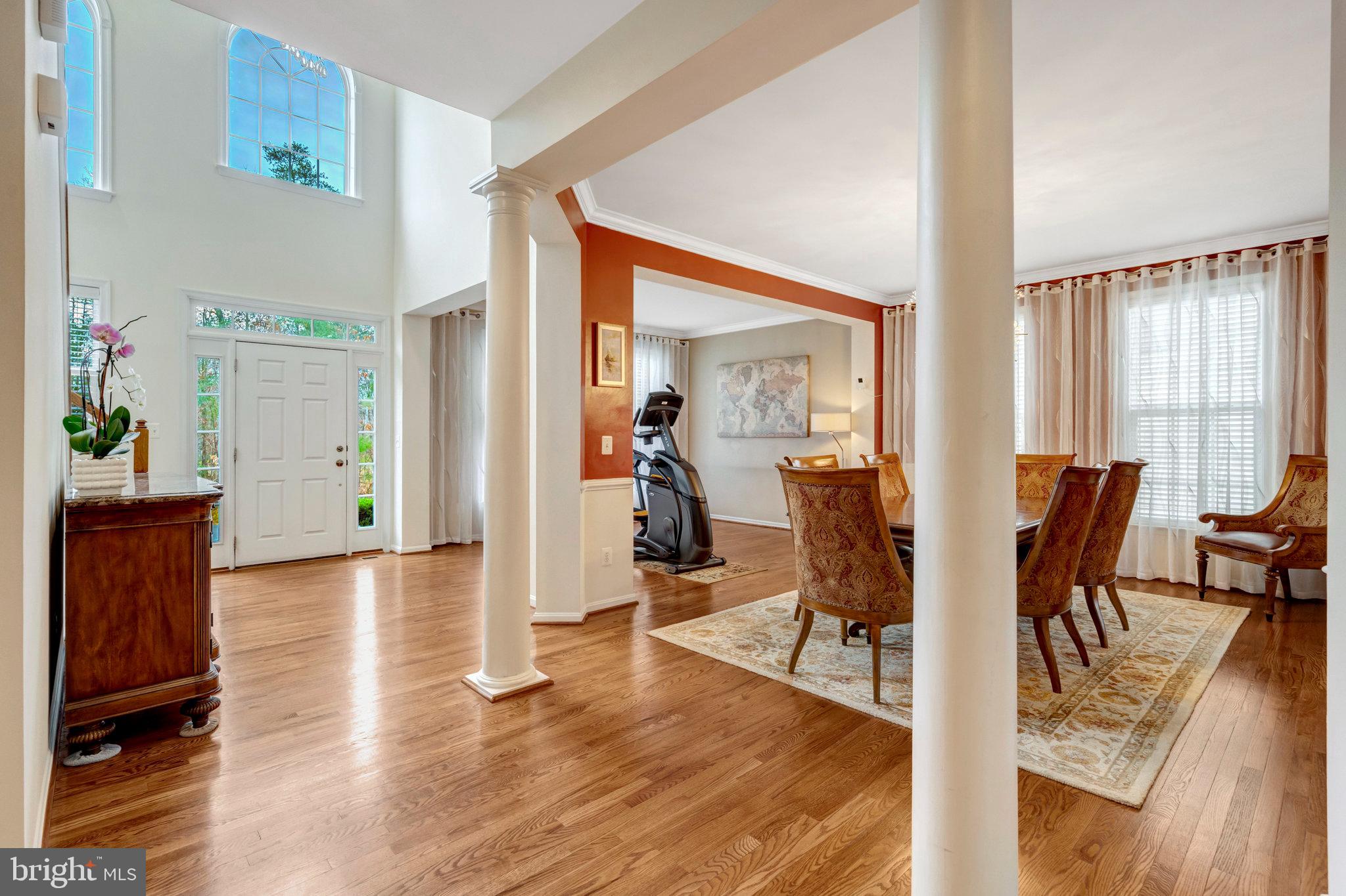 7726 Yalta Way Gainesville, VA 20155 - Photo 12 of 75 a view of a dining room with furniture window and wooden floor