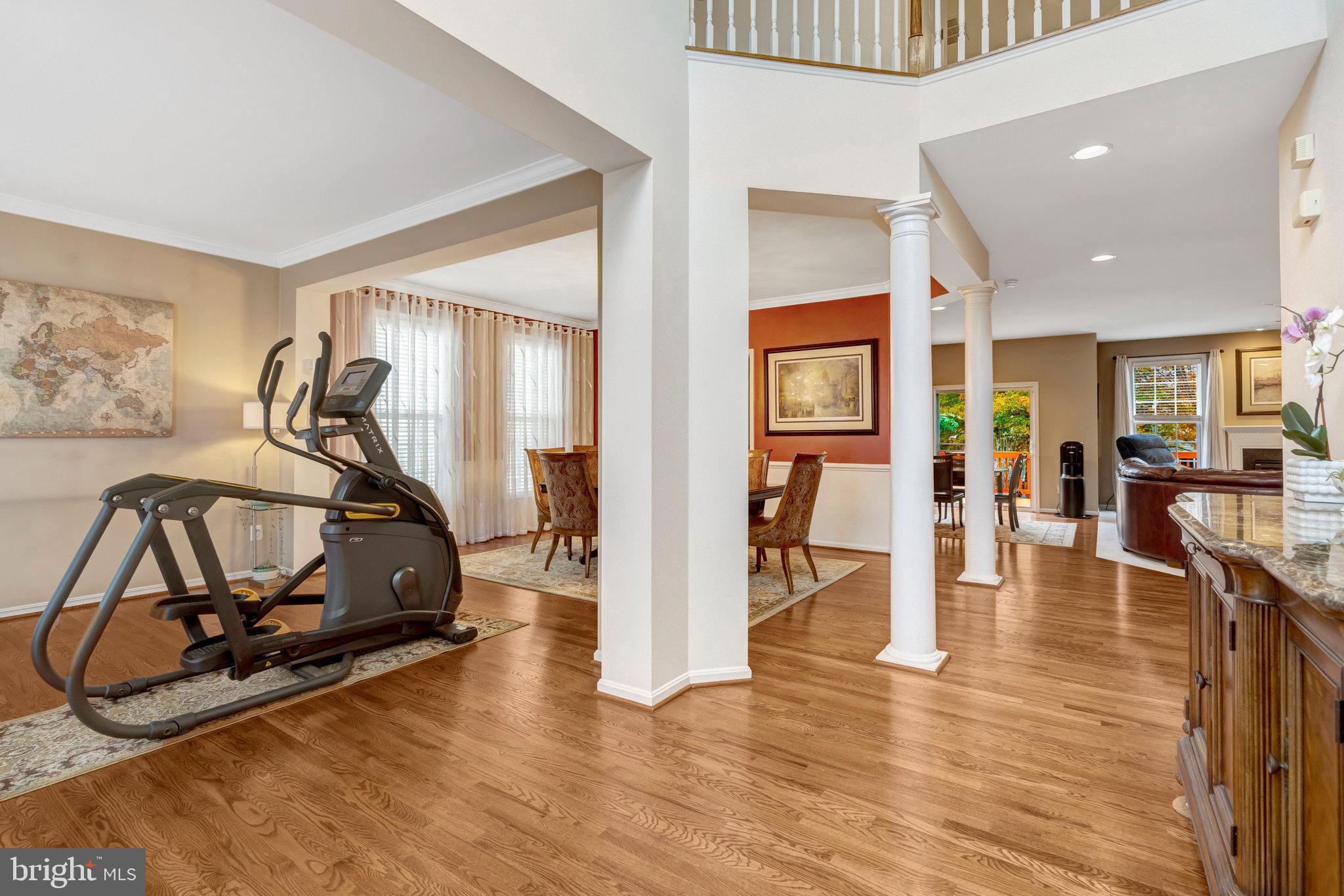 7726 Yalta Way Gainesville, VA 20155 - Photo 14 of 75 a view of a livingroom with furniture and gym equipment