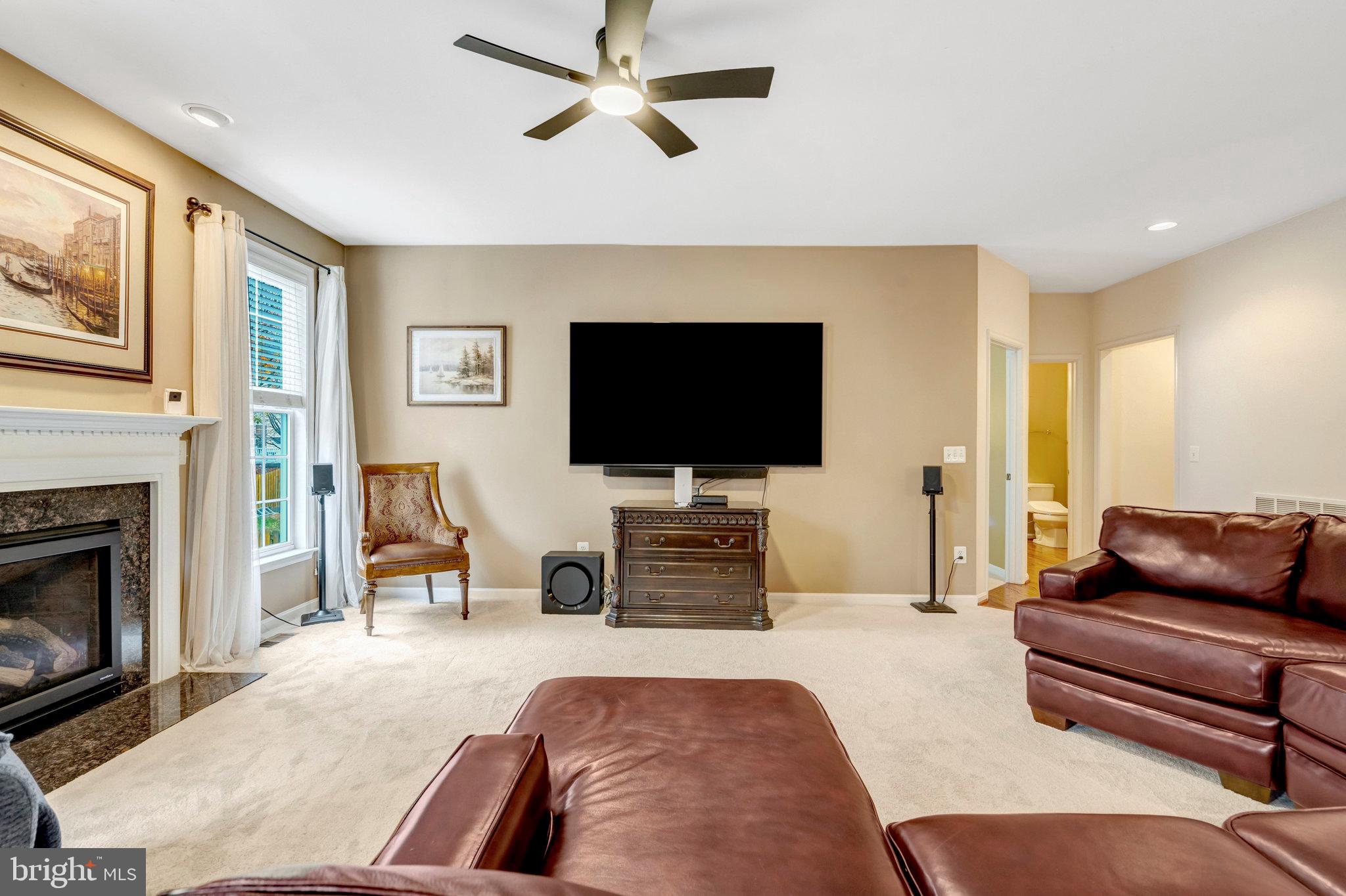 7726 Yalta Way Gainesville, VA 20155 - Photo 19 of 75 a living room with furniture and a flat screen tv