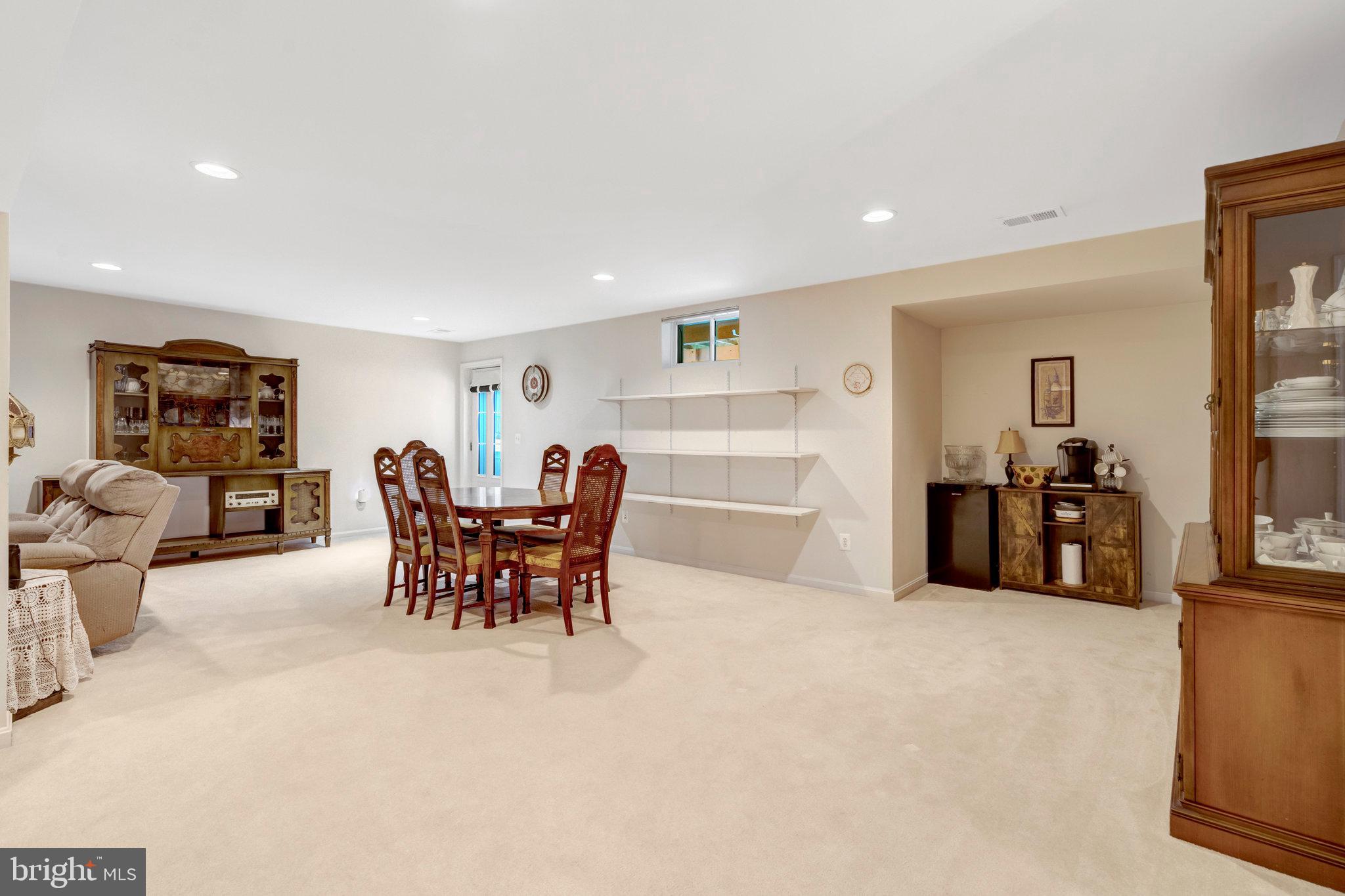 7726 Yalta Way Gainesville, VA 20155 - Photo 29 of 75 a view of a dining room with furniture and a livingroom