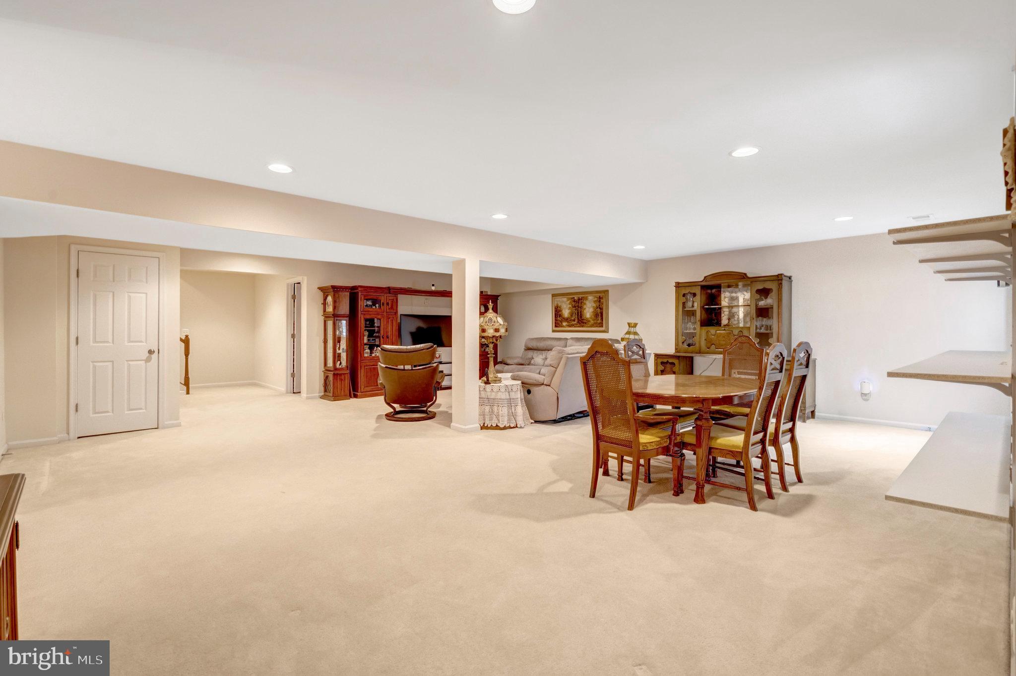 7726 Yalta Way Gainesville, VA 20155 - Photo 31 of 75 a view of a livingroom with furniture and a window