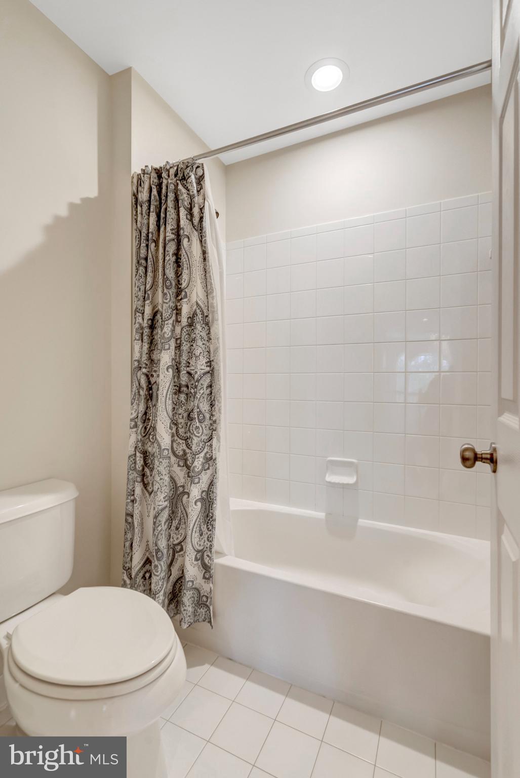 7726 Yalta Way Gainesville, VA 20155 - Photo 44 of 75 a bathroom with a toilet and a shower