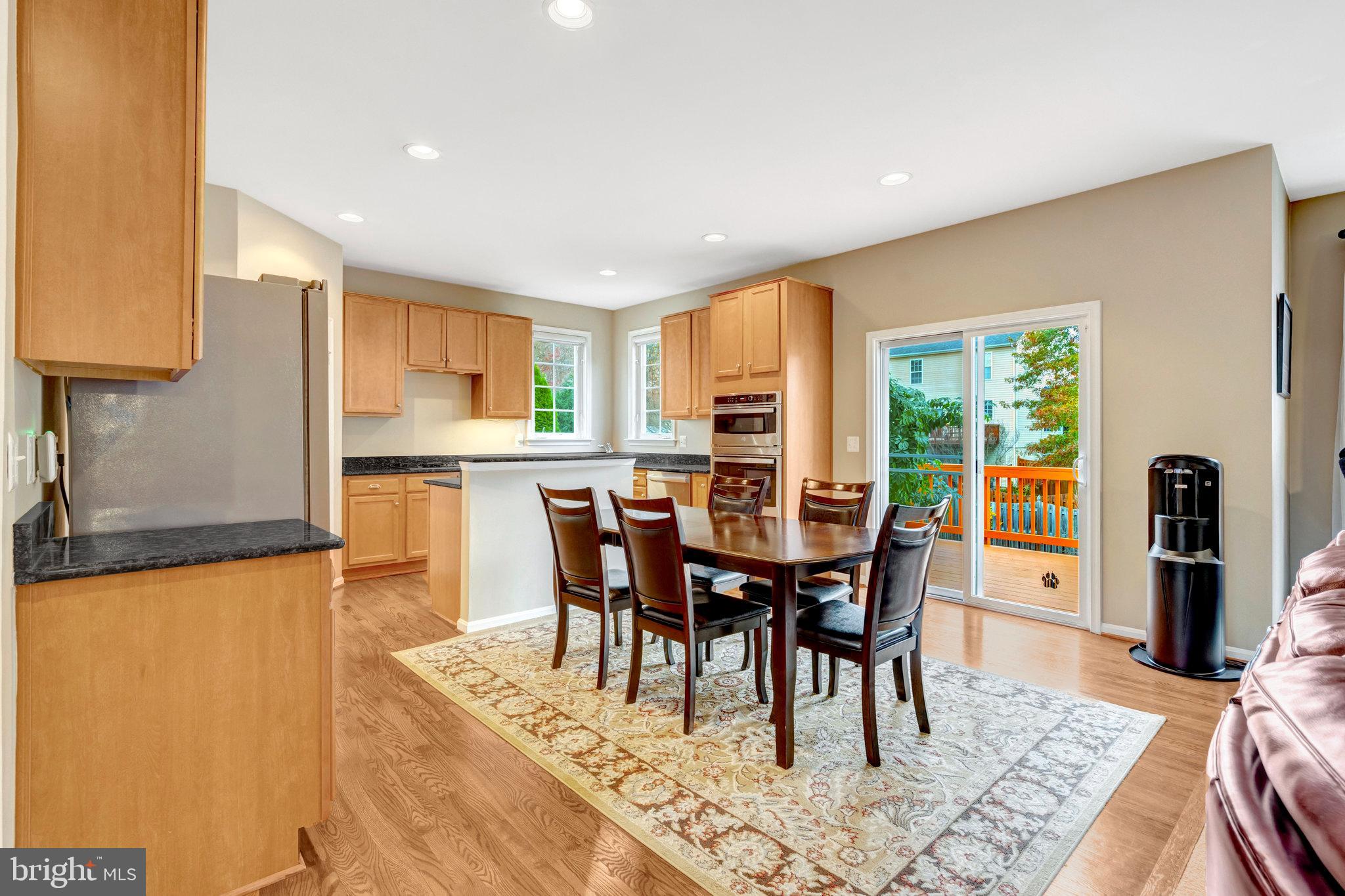 7726 Yalta Way Gainesville, VA 20155 - Photo 5 of 75 a view of a dining room with furniture and a table