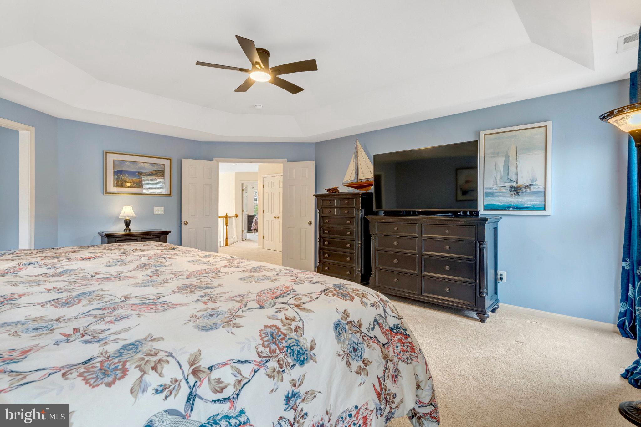7726 Yalta Way Gainesville, VA 20155 - Photo 52 of 75 a bedroom with a bed and a television