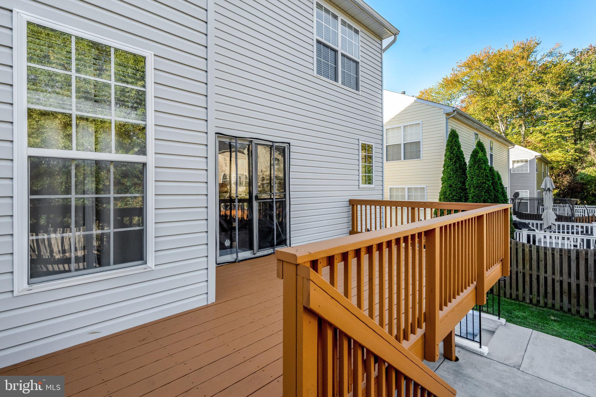 7726 Yalta Way Gainesville, VA 20155 - Photo 62 of 75 a view of deck with a large window and wooden floor