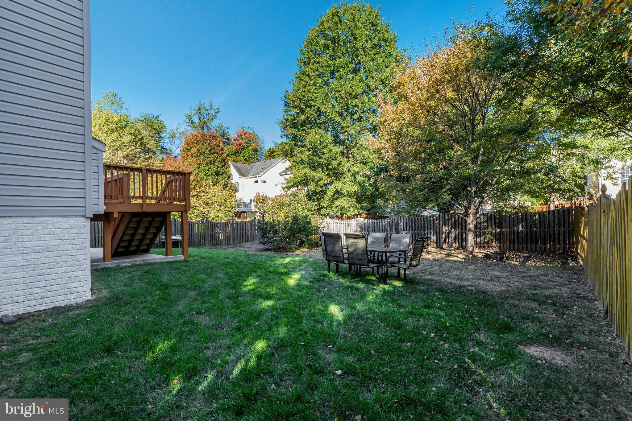 7726 Yalta Way Gainesville, VA 20155 - Photo 67 of 75 a view of backyard with a table and chairs
