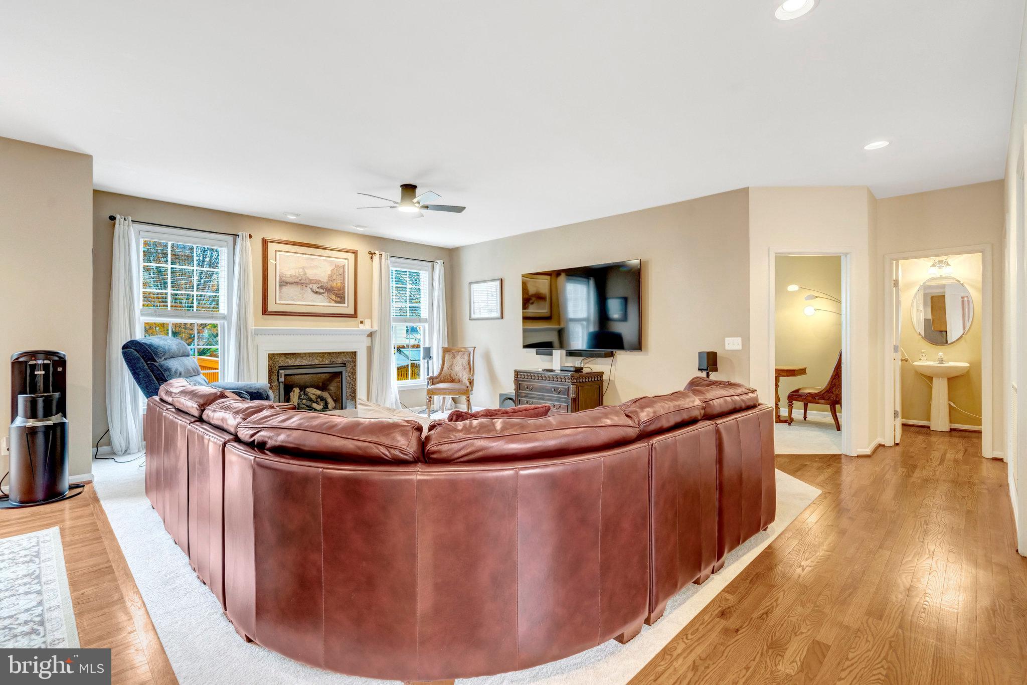 7726 Yalta Way Gainesville, VA 20155 - Photo 8 of 75 a living room with furniture and a fireplace