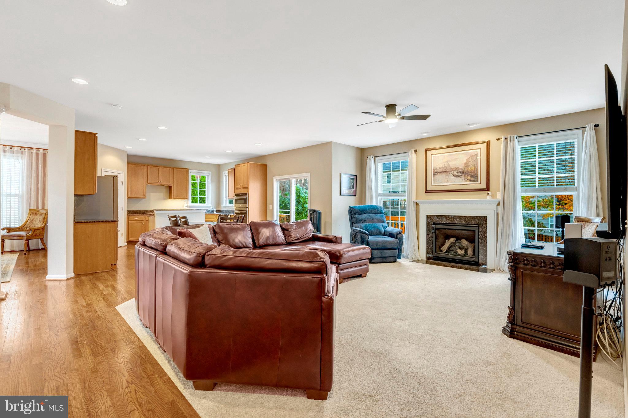 7726 Yalta Way Gainesville, VA 20155 - Photo 9 of 75 a living room with furniture and a fireplace