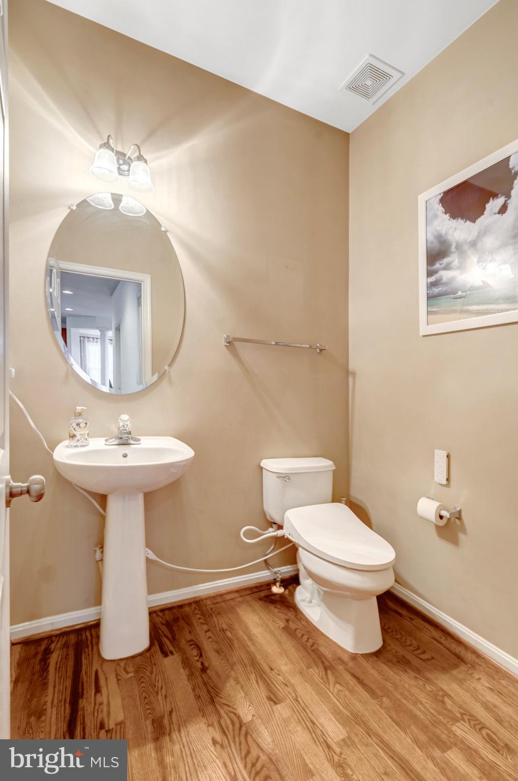 7726 Yalta Way Gainesville, VA 20155 - Photo 10 of 75 a bathroom with a toilet sink and mirror