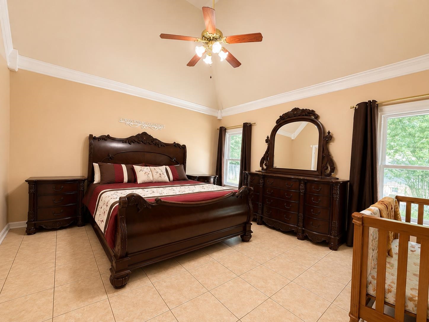 326 South Sanga Road Cordova, TN 38018 - Photo 17 of 32 Spacious room featuring vaulted ceilings, crown molding, and neutral wall tones