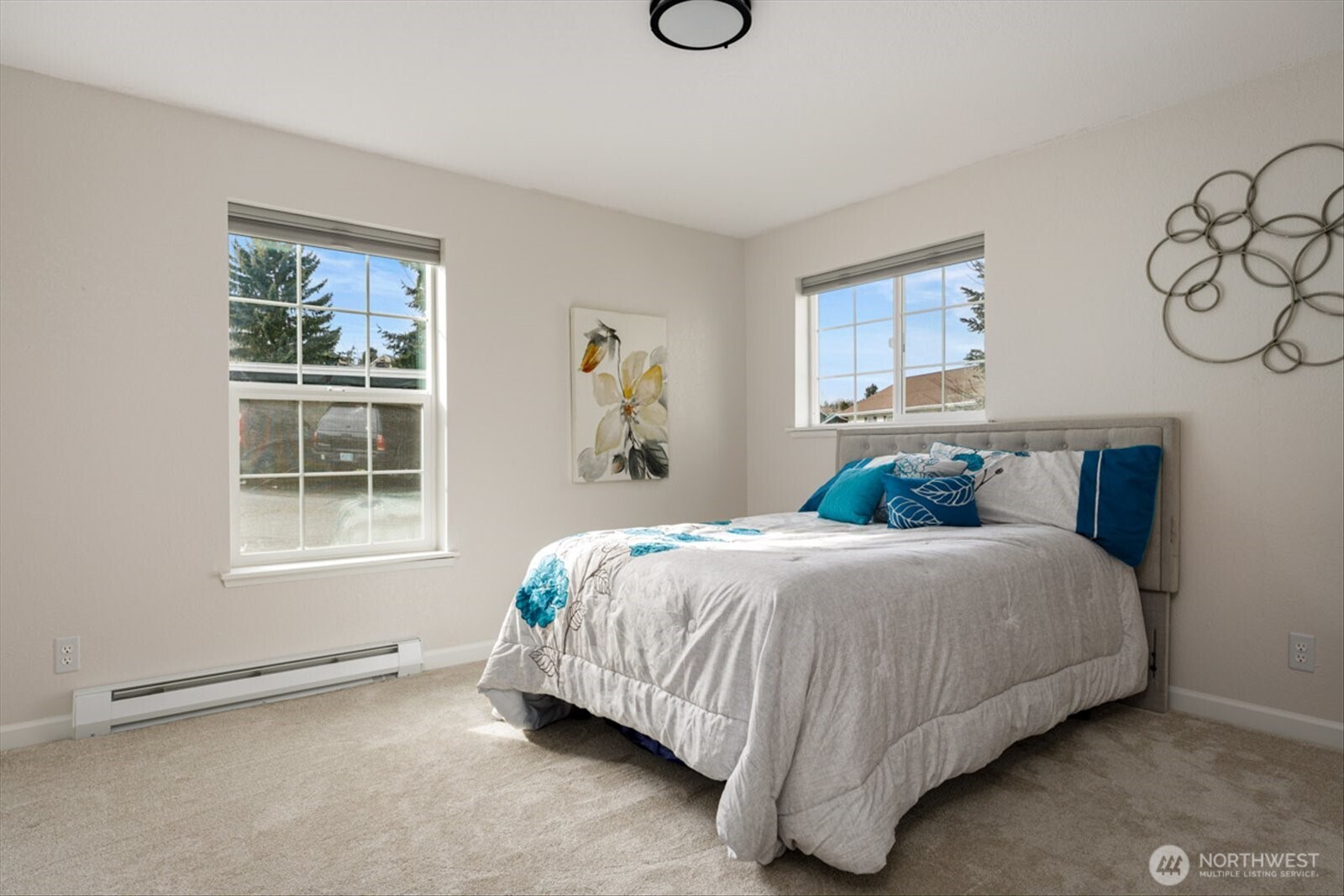 566 Creekside Terrace, Unit 101 Langley, WA 98260 - Photo 16 of 31 a bedroom with a bed and a window