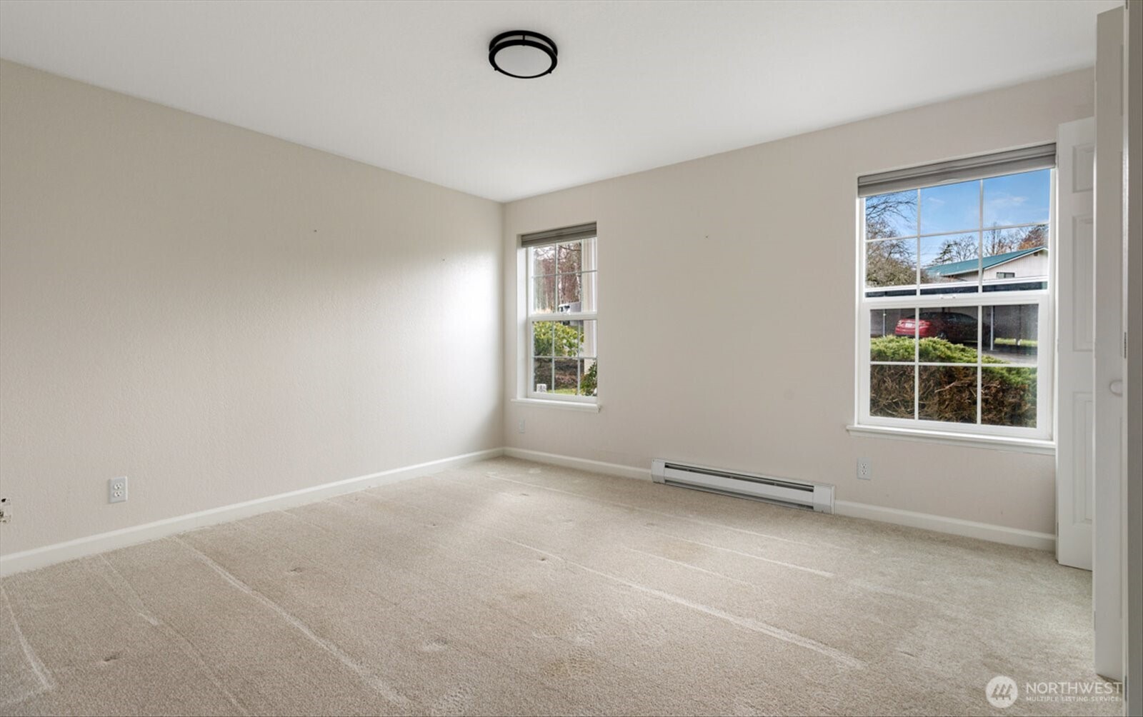 566 Creekside Terrace, Unit 101 Langley, WA 98260 - Photo 18 of 31 an empty room with windows
