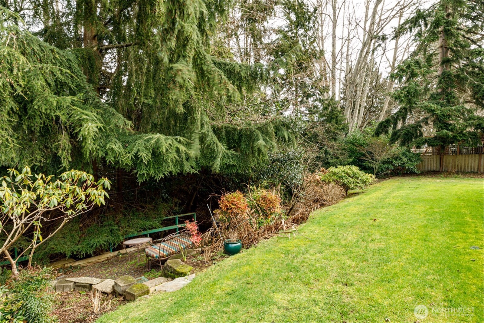 566 Creekside Terrace, Unit 101 Langley, WA 98260 - Photo 23 of 31 a backyard of a house with lots of green space