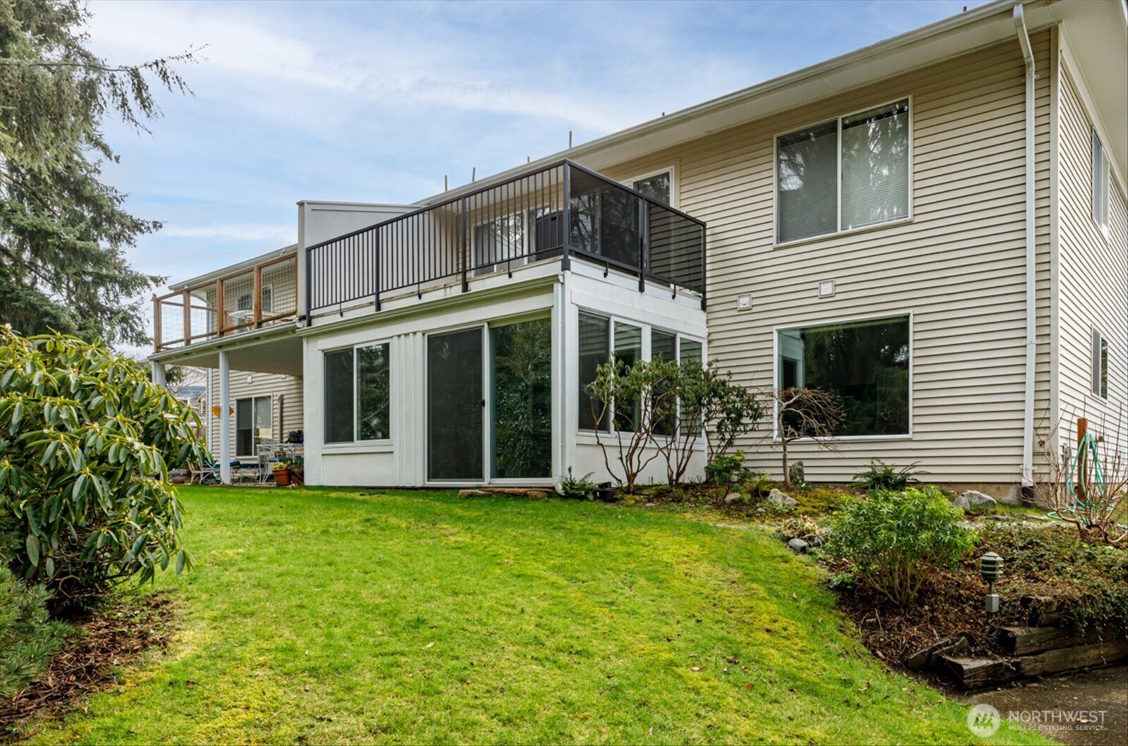 566 Creekside Terrace, Unit 101 Langley, WA 98260 - Photo 3 of 31 a view of a house with a yard and potted plants