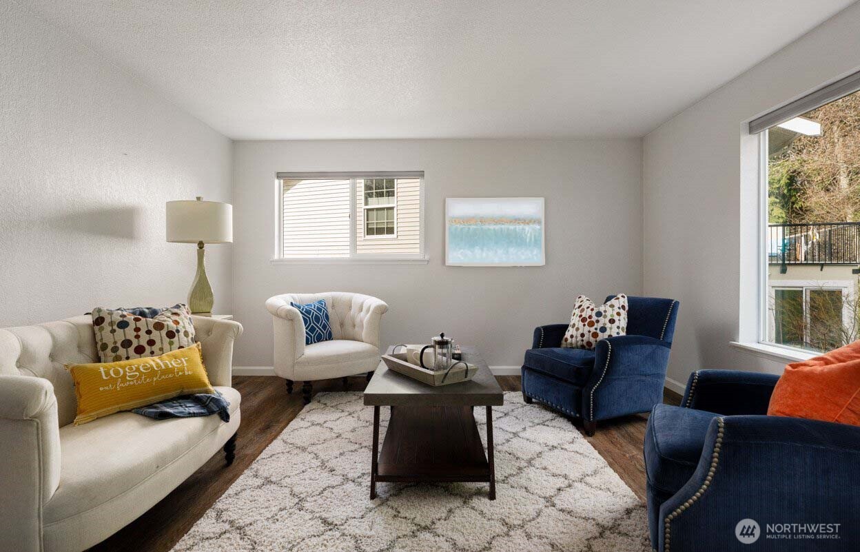566 Creekside Terrace, Unit 101 Langley, WA 98260 - Photo 8 of 31 a living room with furniture and a large window