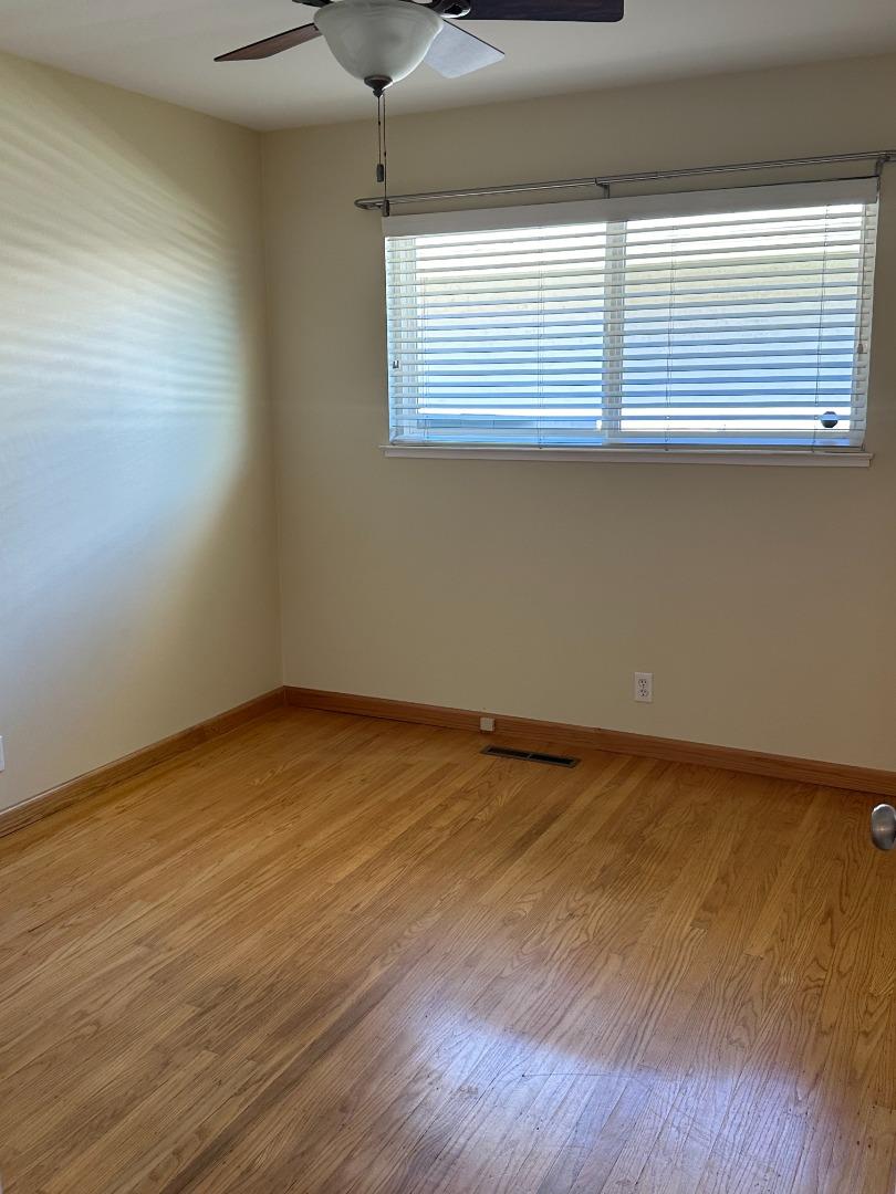 2046 Anthony Drive Campbell, CA 95008 - Photo 13 of 18 a view of an empty room with wooden floor and a window