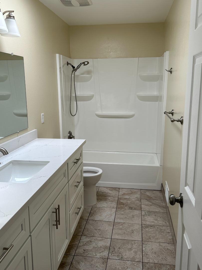 2046 Anthony Drive Campbell, CA 95008 - Photo 15 of 18 a bathroom with a granite countertop sink a toilet and shower