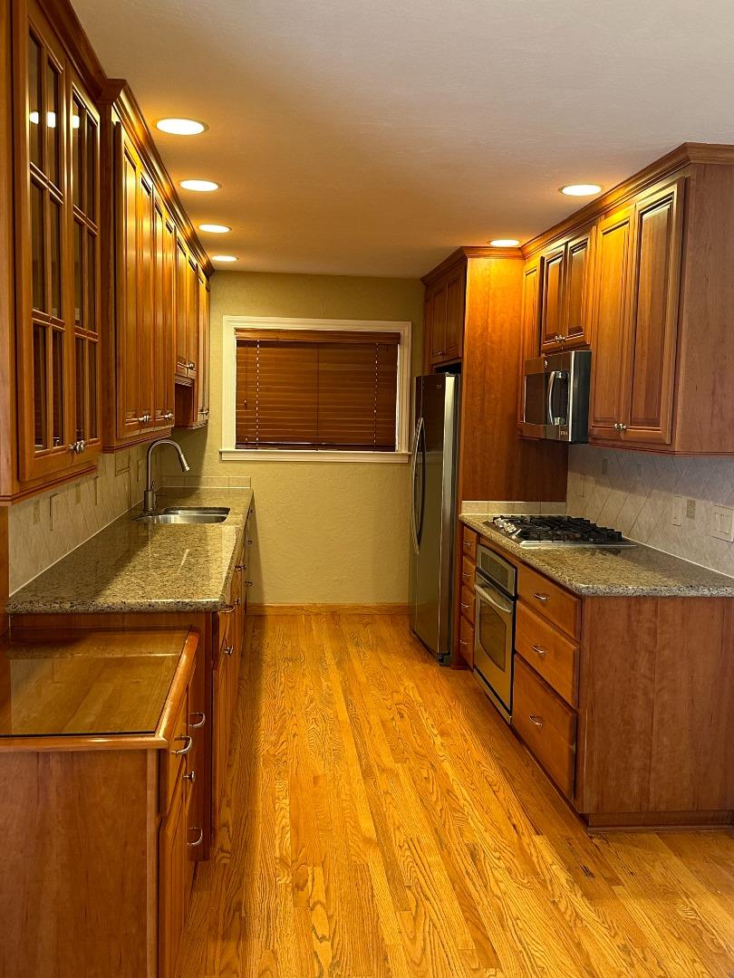 2046 Anthony Drive Campbell, CA 95008 - Photo 4 of 18 a kitchen with stainless steel appliances granite countertop a sink and a stove