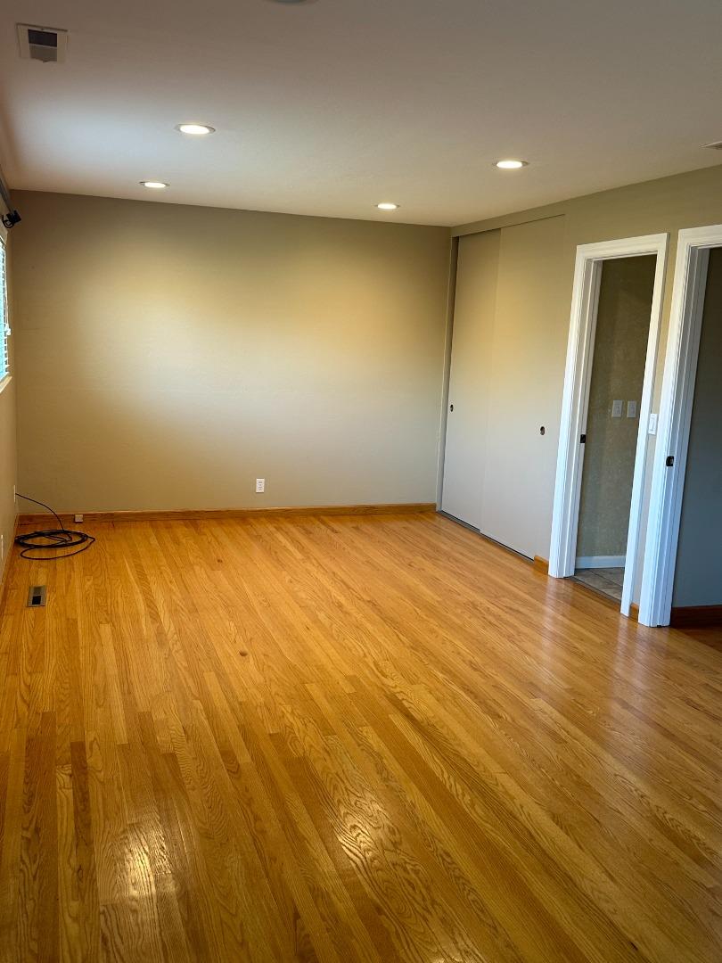2046 Anthony Drive Campbell, CA 95008 - Photo 10 of 18 an empty room with wooden floor and entrance